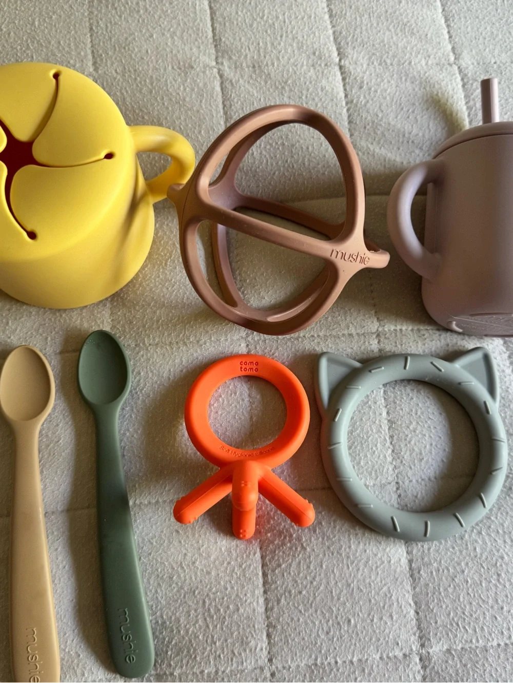 Mushie lot of teethers, spoons, snack catcher, sippy cup